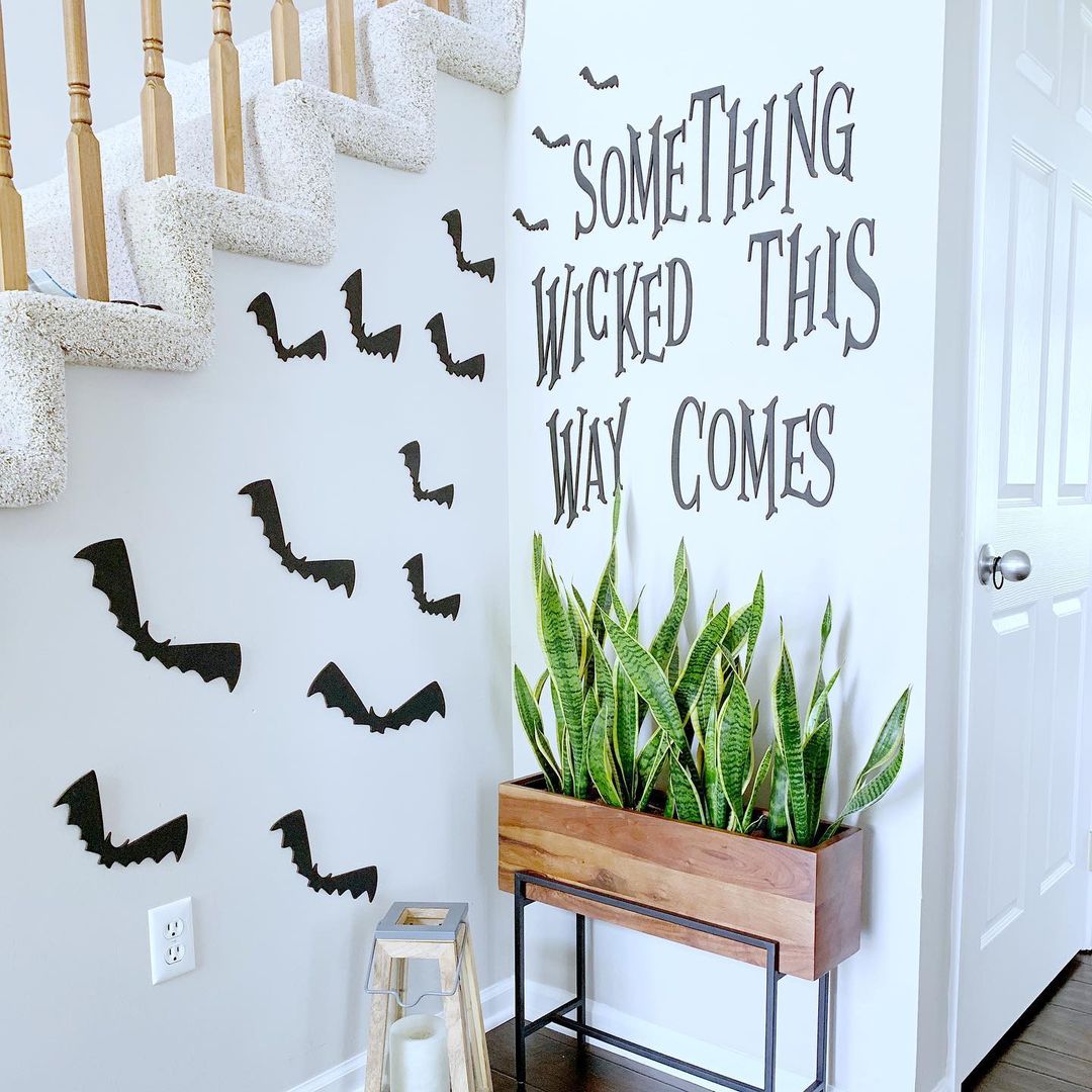 15. Minimalist Halloween Staircase with Spooky Wall Art