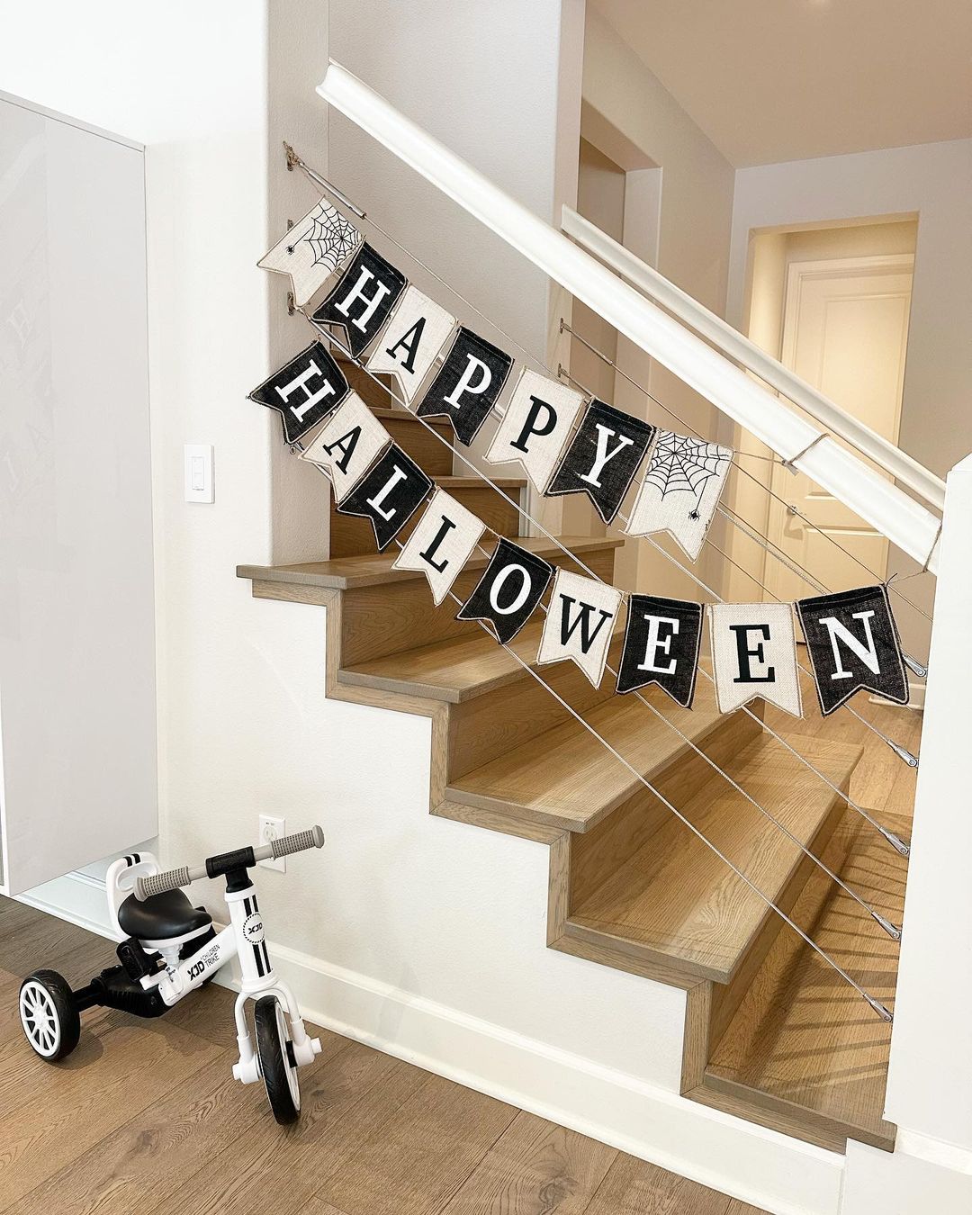 Simple and Cheerful Halloween Staircase with Festive Banner