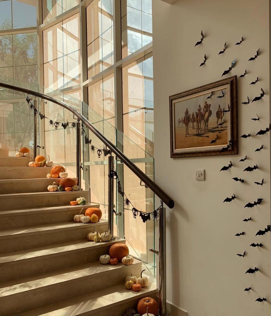 Elegant Halloween Staircase with Pumpkins and Bat Accents