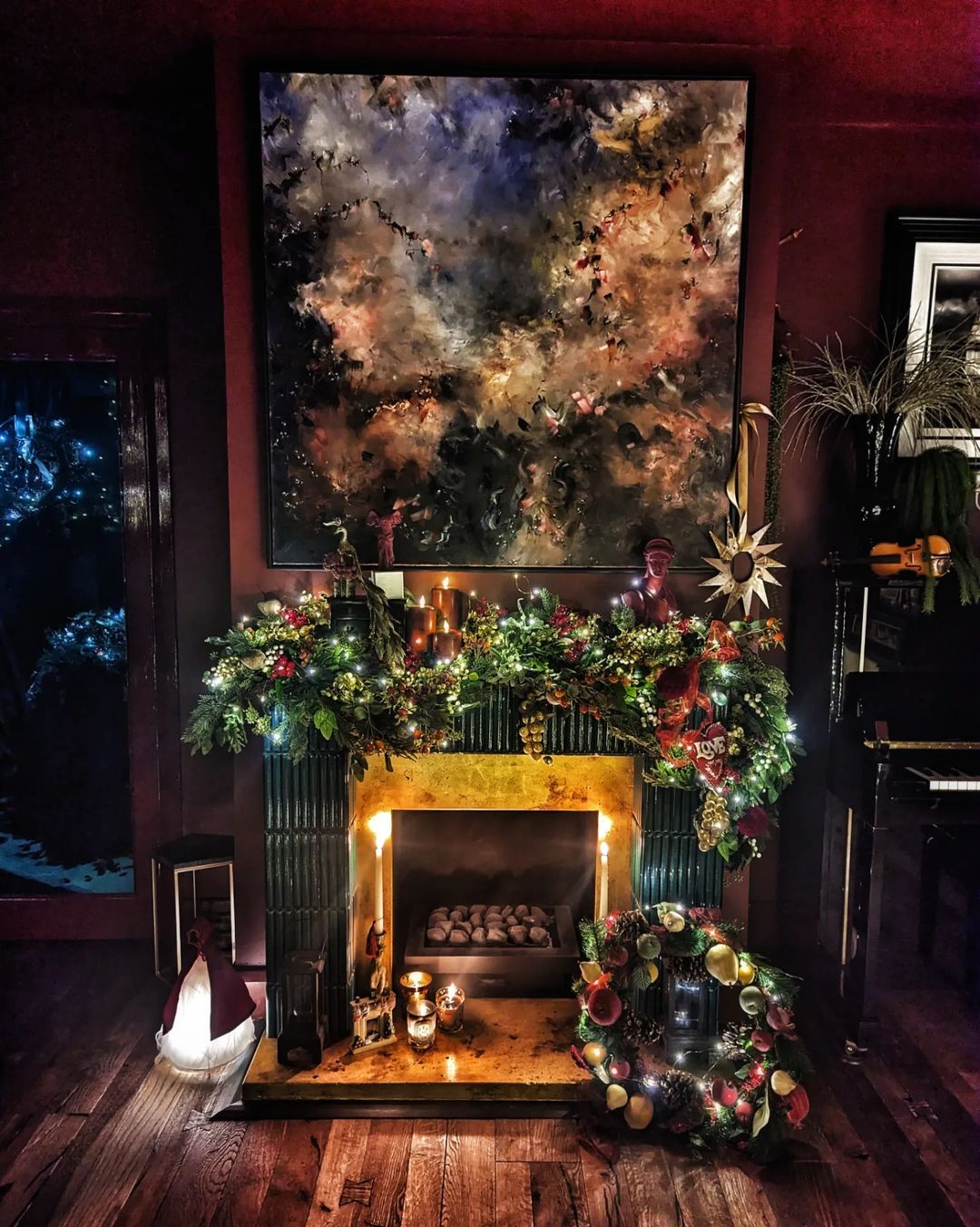 Dramatic Fireplace Mantel with Bold Art and Festive Greenery