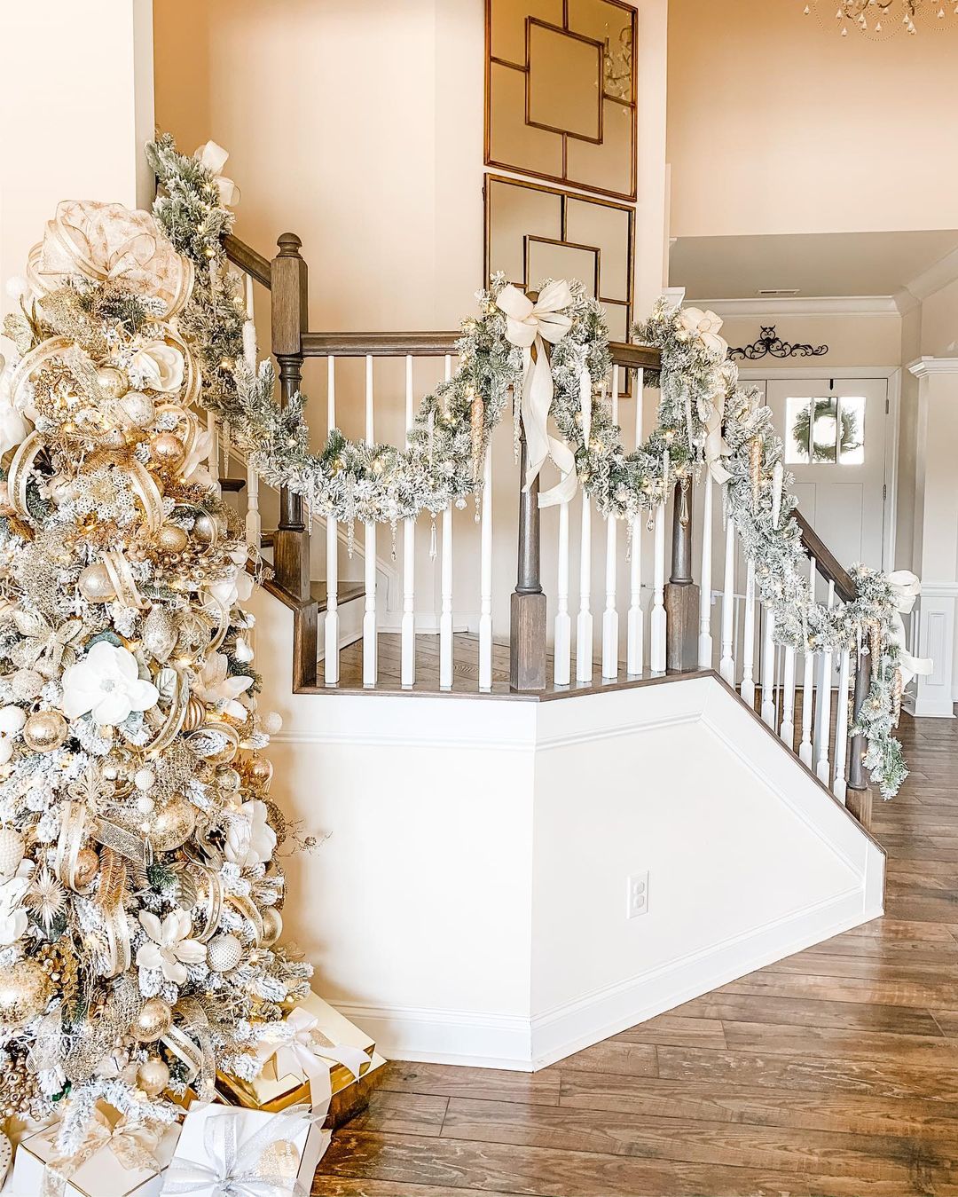 Create a Grand Entrance with White and Gold Staircase Decor