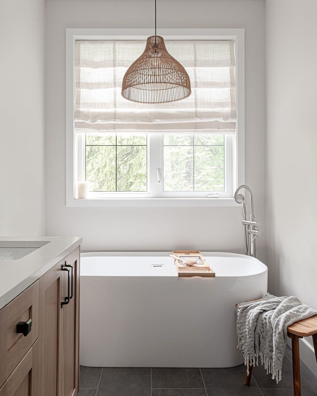 bathroom with window above tub