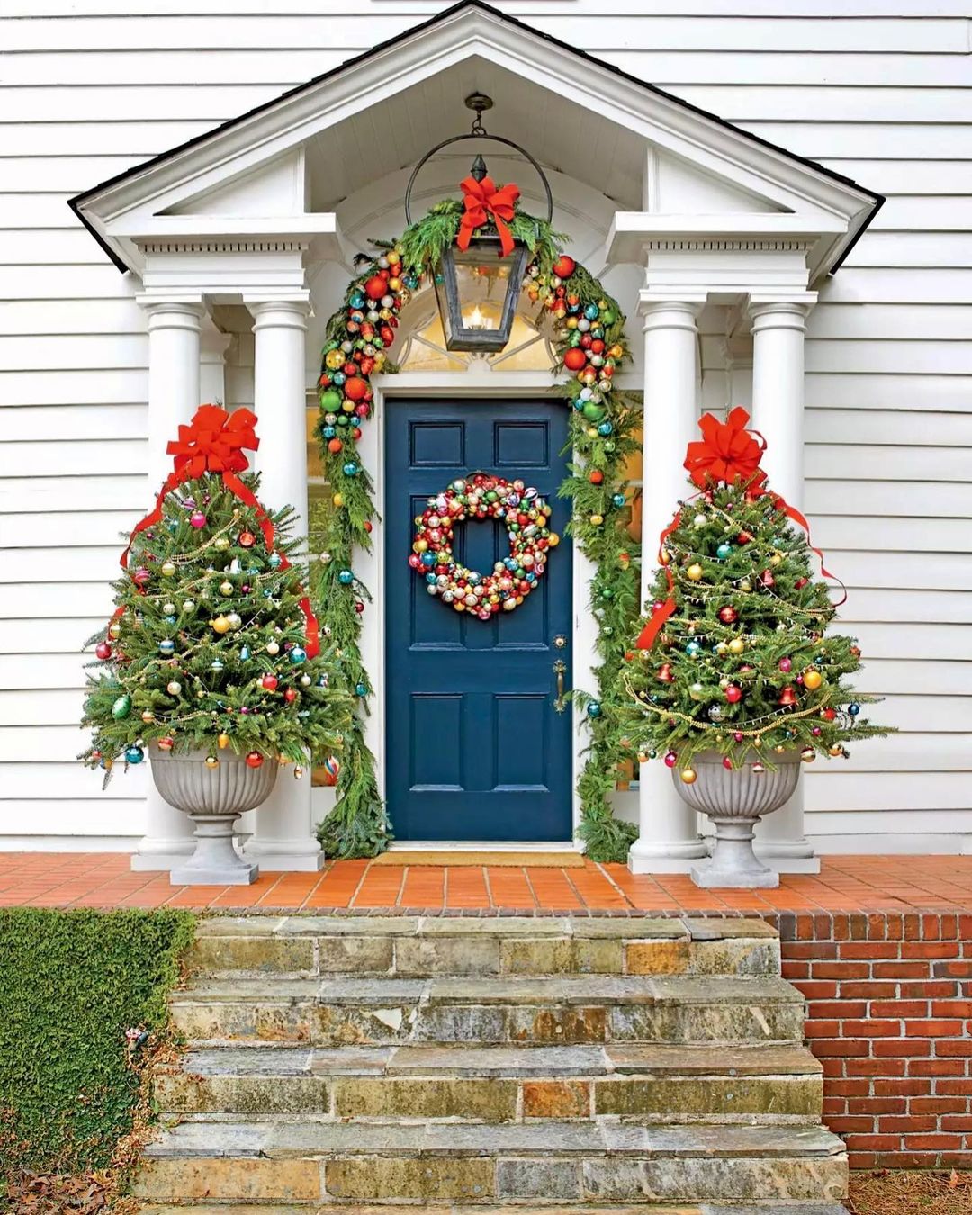 Colorful Ornament-Covered Trees for a Bright Christmas Entryway