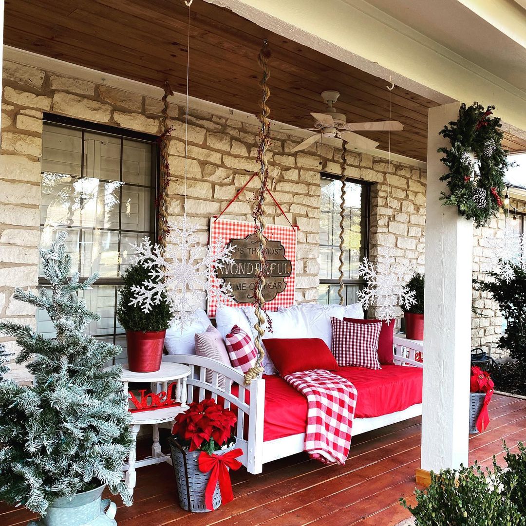 12. Cozy Porch Seating with Gingham and Festive Red Accents