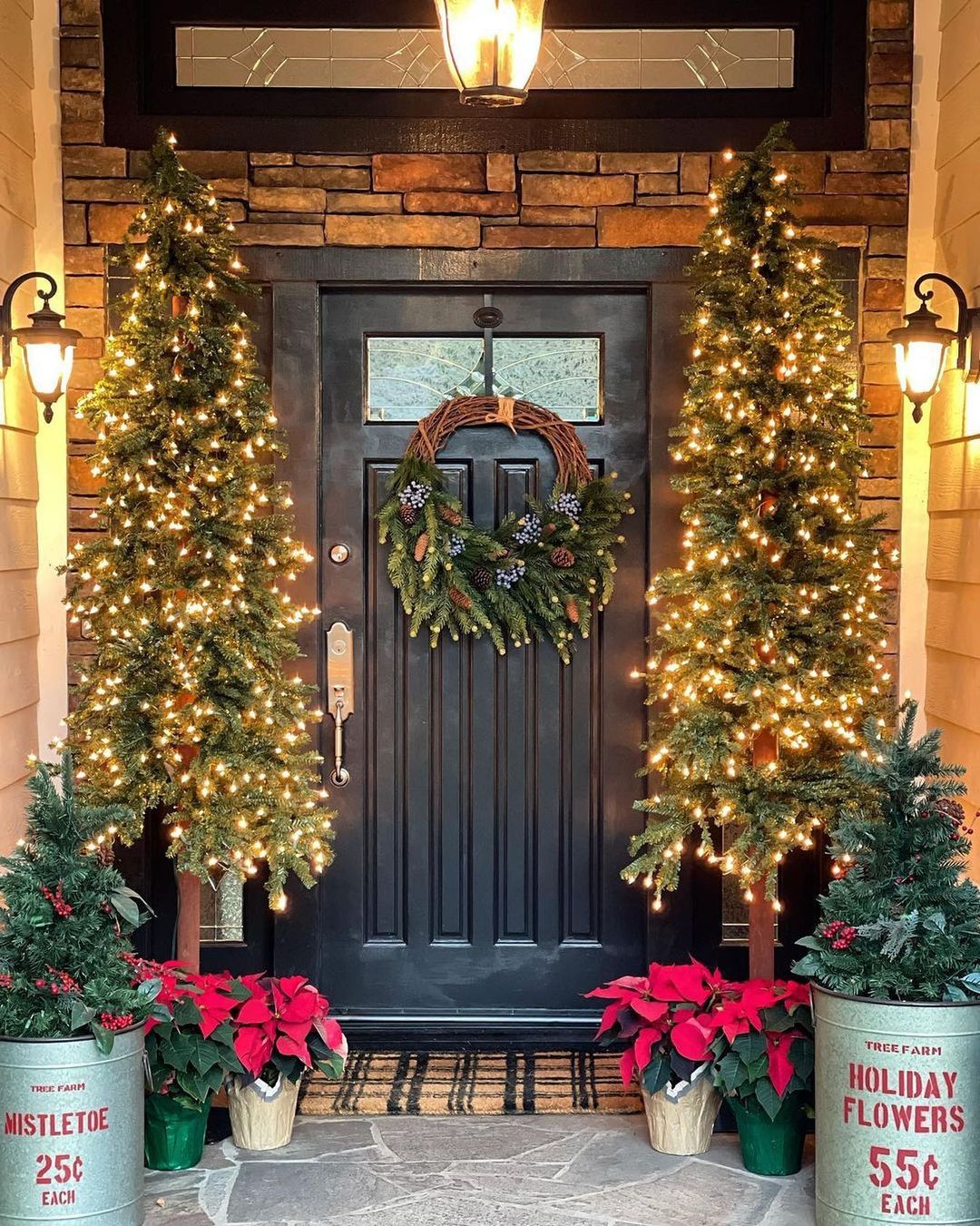 2. Warm Up Your Front Porch with Lit Trees and Rustic Accents