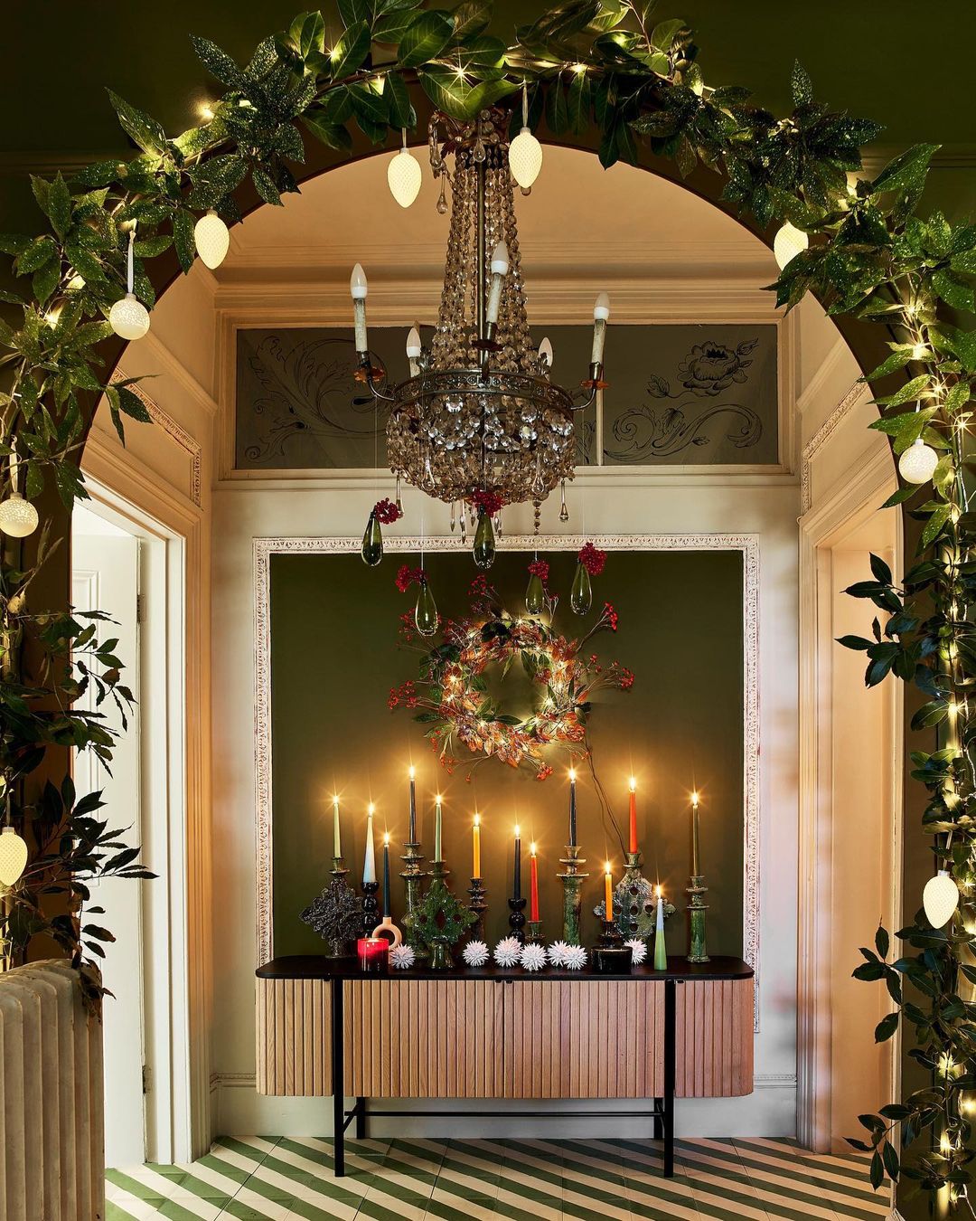 Create a Grand Entrance with Elegant Greenery and Bold Lighting