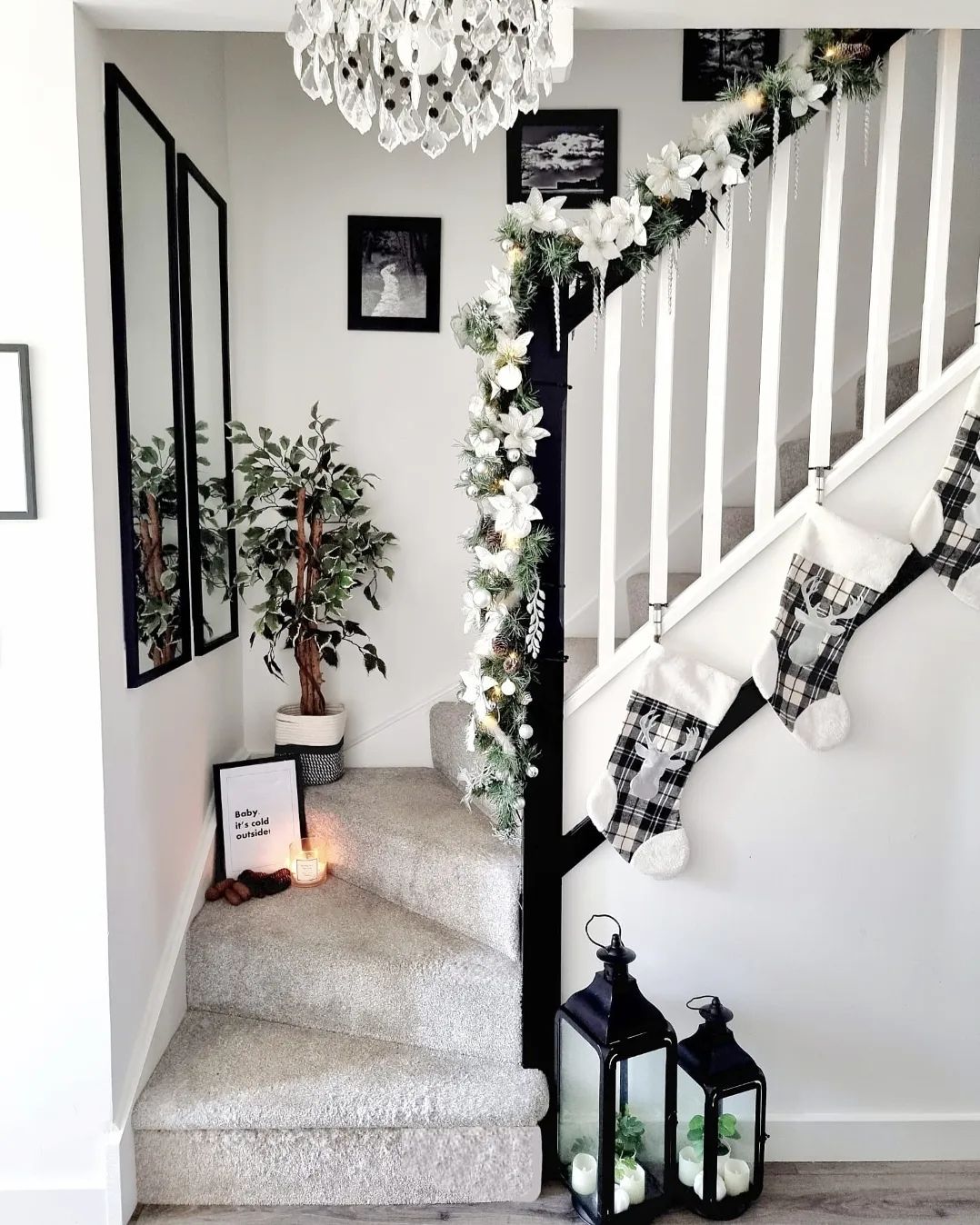 Elegant Black and White Staircase Decor with Cosy Accents