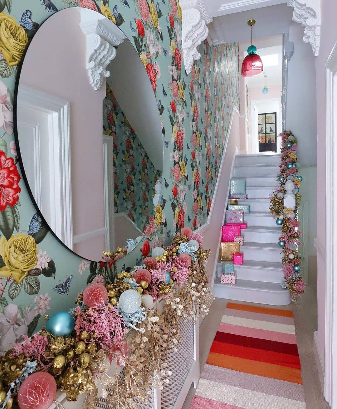 Embrace Bold Colors with Vibrant Holiday Decor in a Floral Hallway