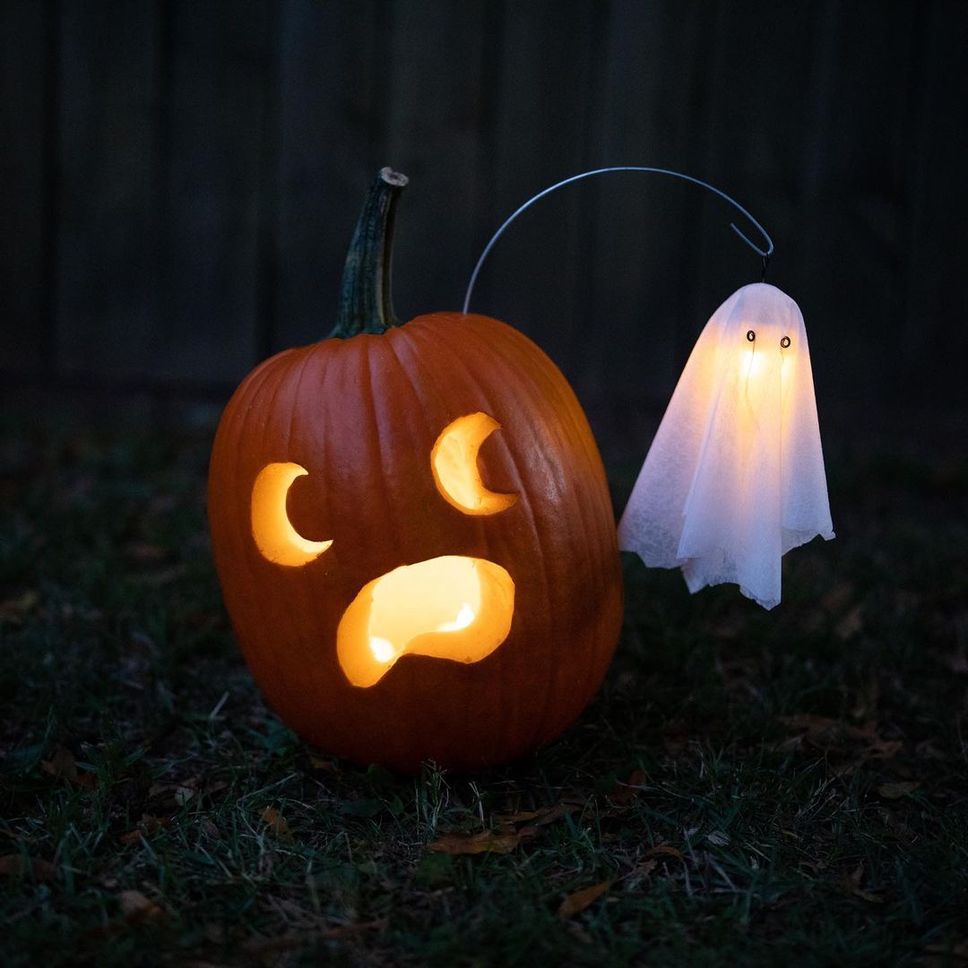 Spooky Pumpkin with Floating Ghost for a Haunted Halloween Display