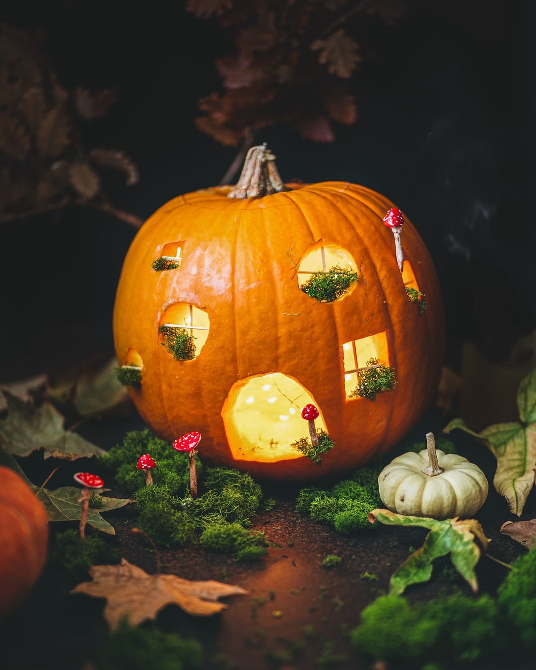 Enchanted Pumpkin Cottage with Moss Accents for a Fairy-Tale Halloween