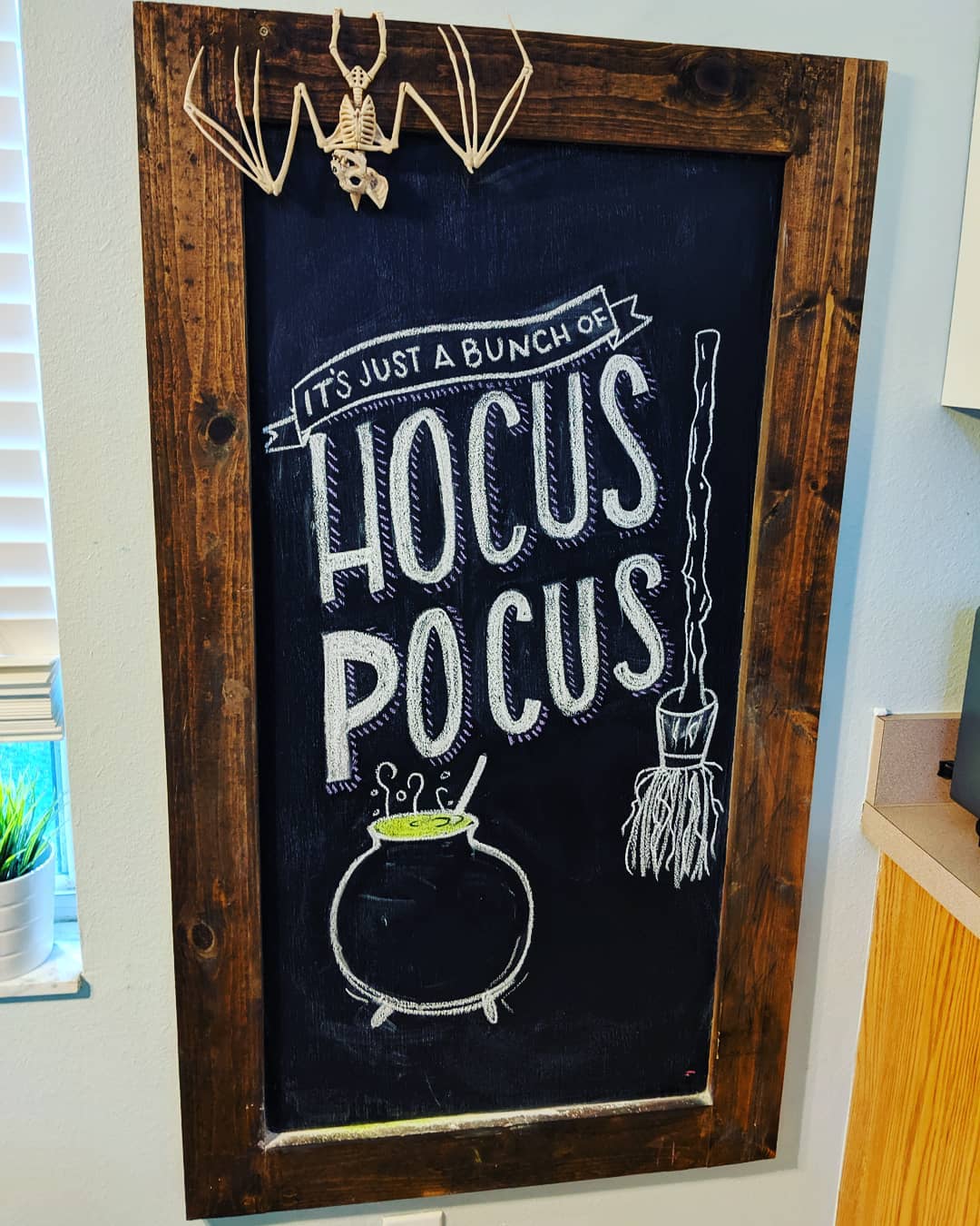 Add a Touch of Witchy Fun with a "Hocus Pocus" Chalkboard