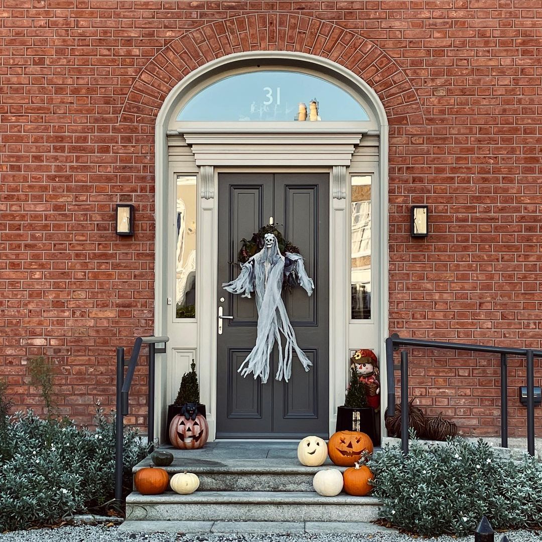 Ghostly Halloween Entrance with Hanging Spirit