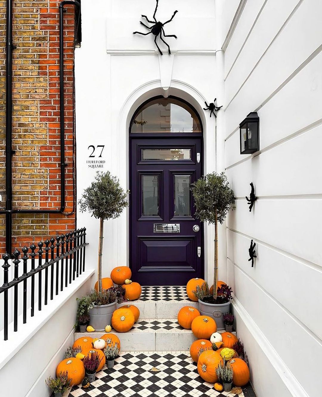 Sophisticated Halloween Entrance with Spiders and Pumpkins