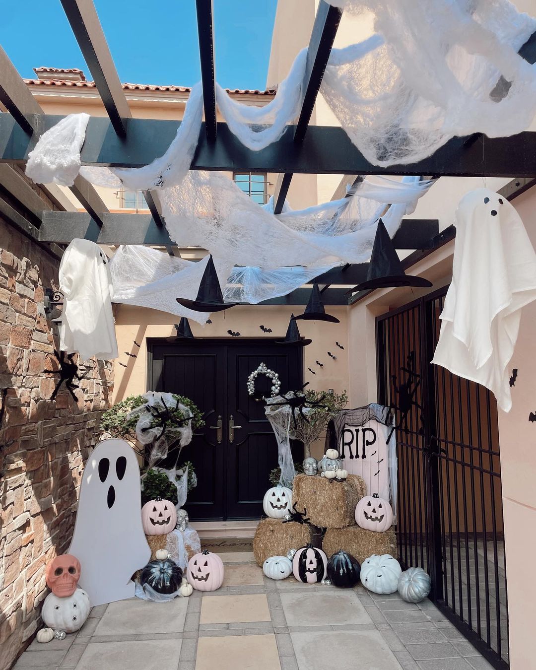 Haunted Courtyard with Ghosts and Witch Hats