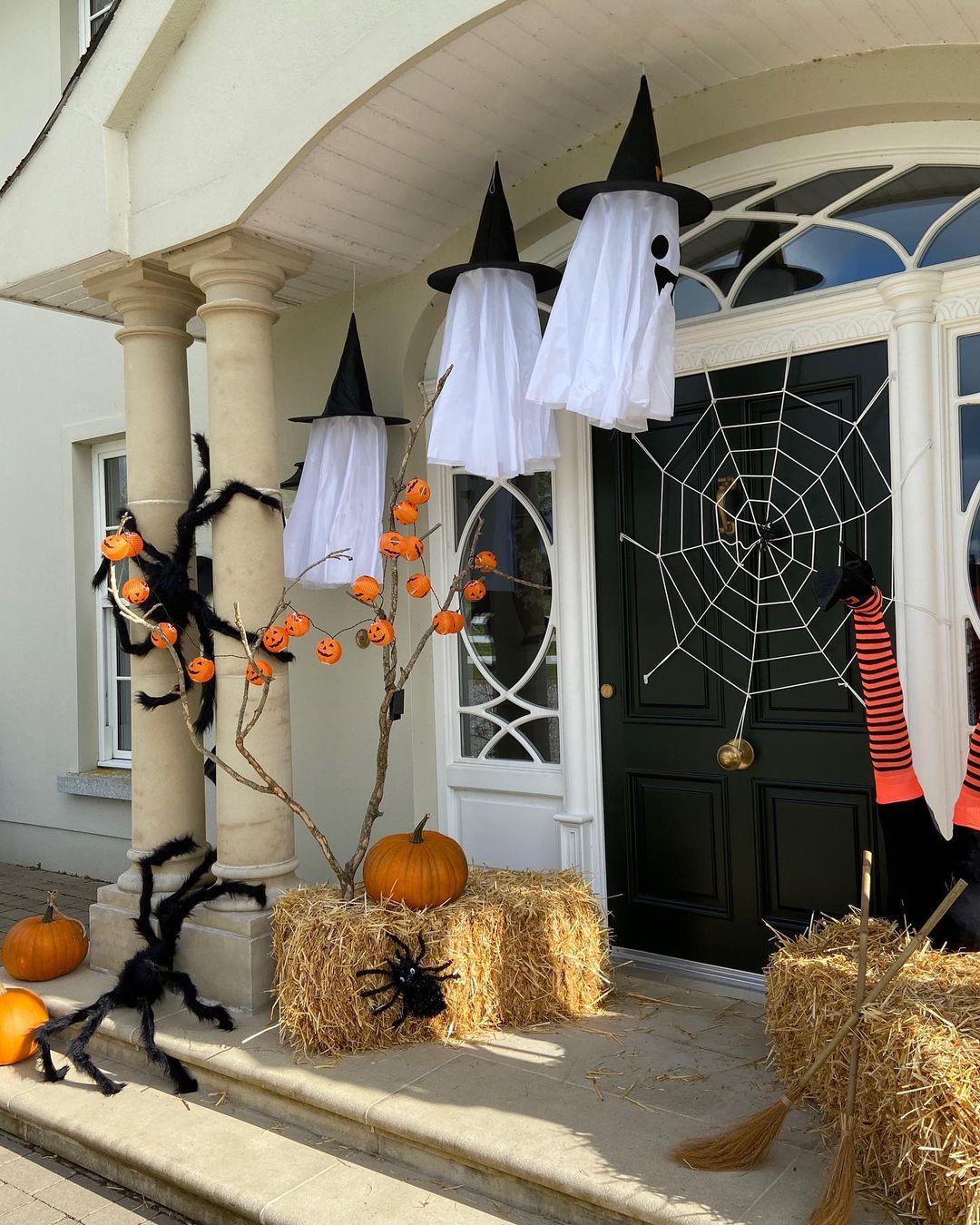 Whimsical Halloween Porch with Witch Hats and Spiders