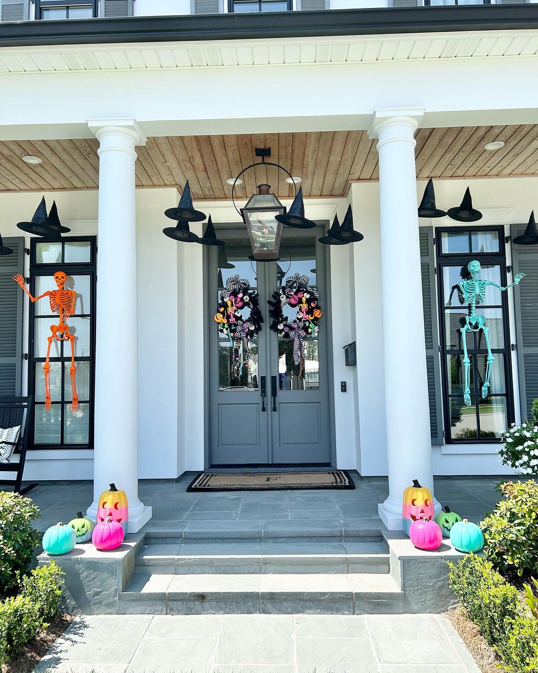 Colorful Skeletons and Floating Witch Hats for a Bright Halloween Porch