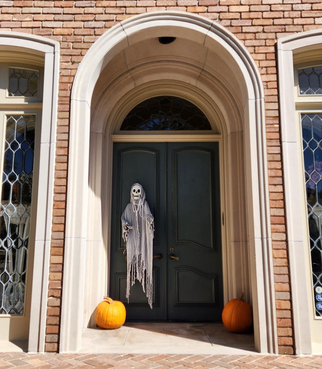 Minimalist Halloween Entrance with Ghostly Figure