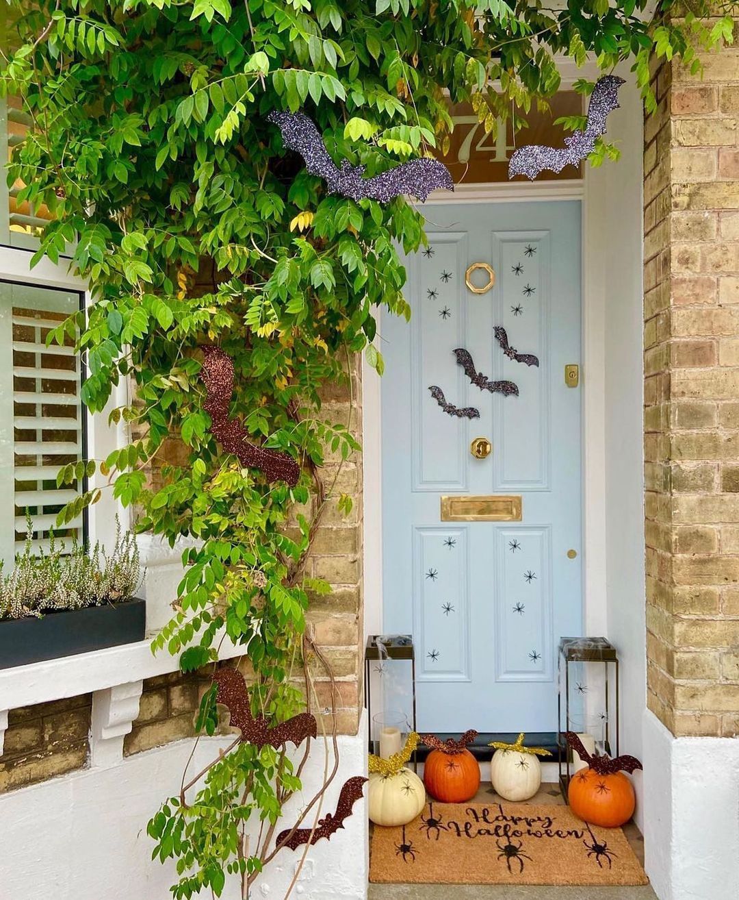 Charming Halloween Porch with Glittery Bats and Pumpkins