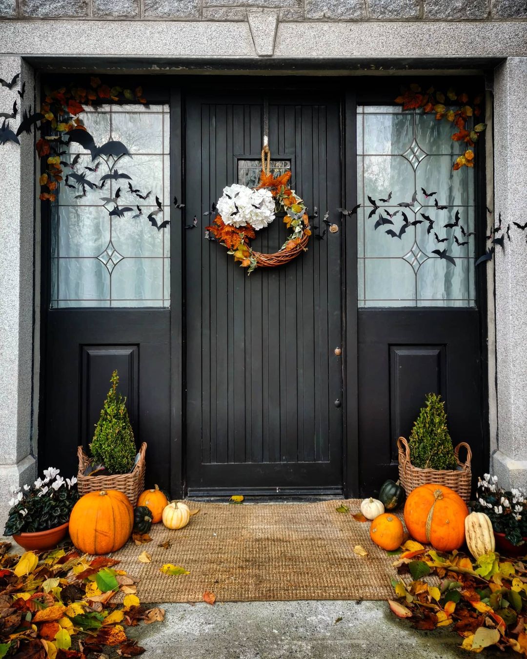 Rustic Halloween Entrance with Bats and Autumn Wreath