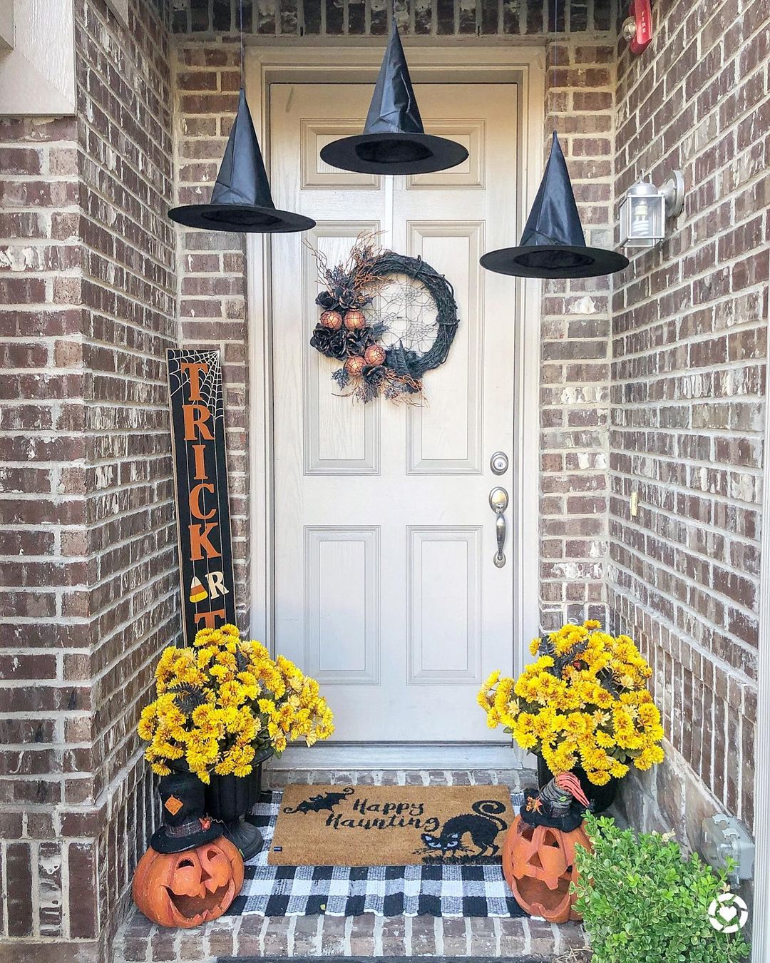 Witchy Halloween Porch with Floating Hats and Pumpkin Planters