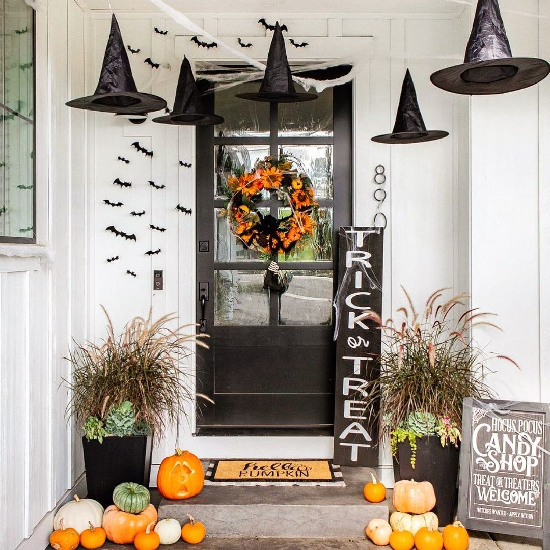 Welcoming Halloween Porch with Floating Witch Hats and Bat Decor