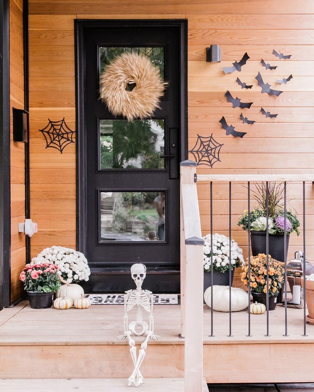 Minimalist Halloween Porch with Bats and Skeleton