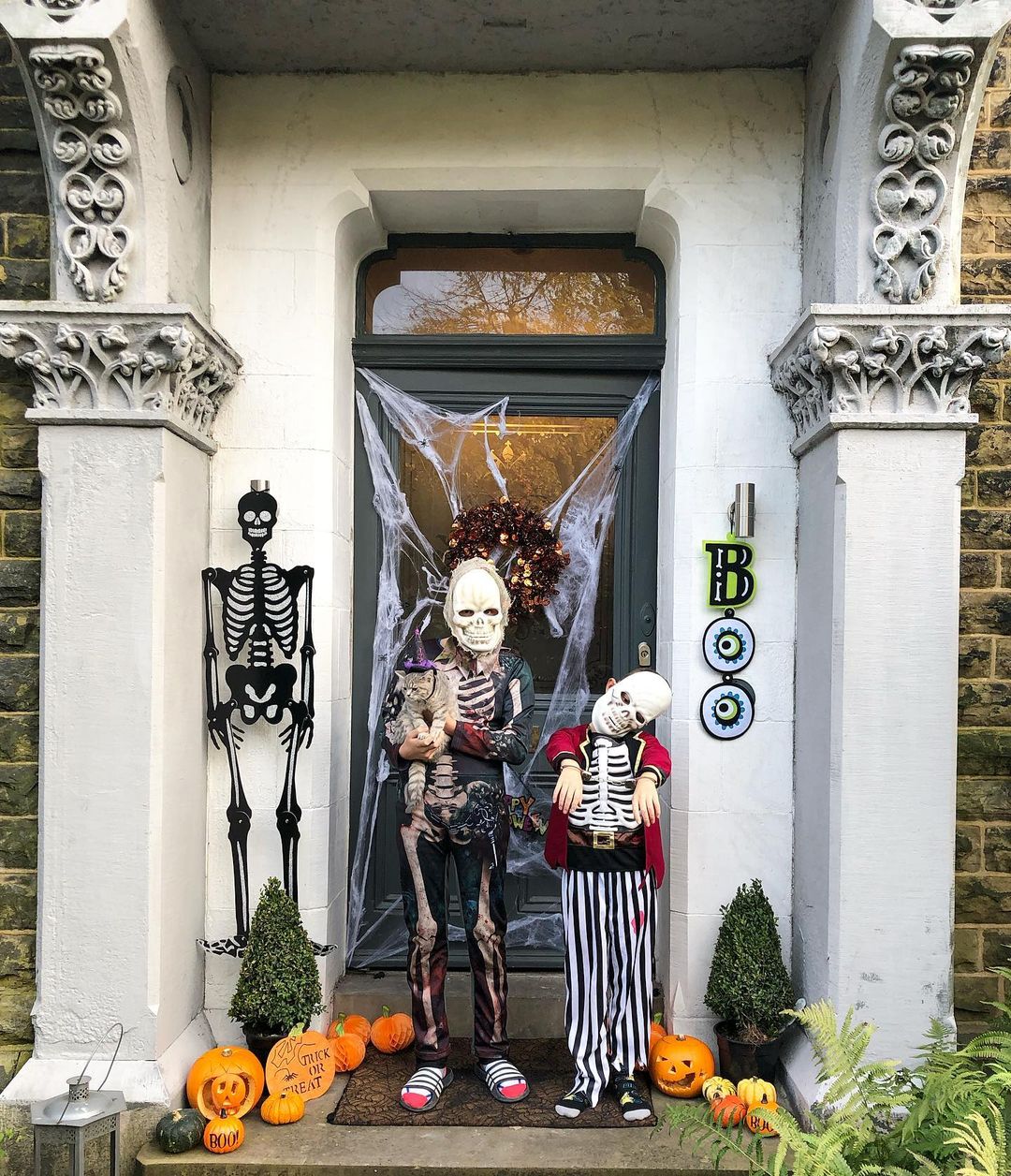 Charming Halloween Porch with Black Cat and Pumpkins