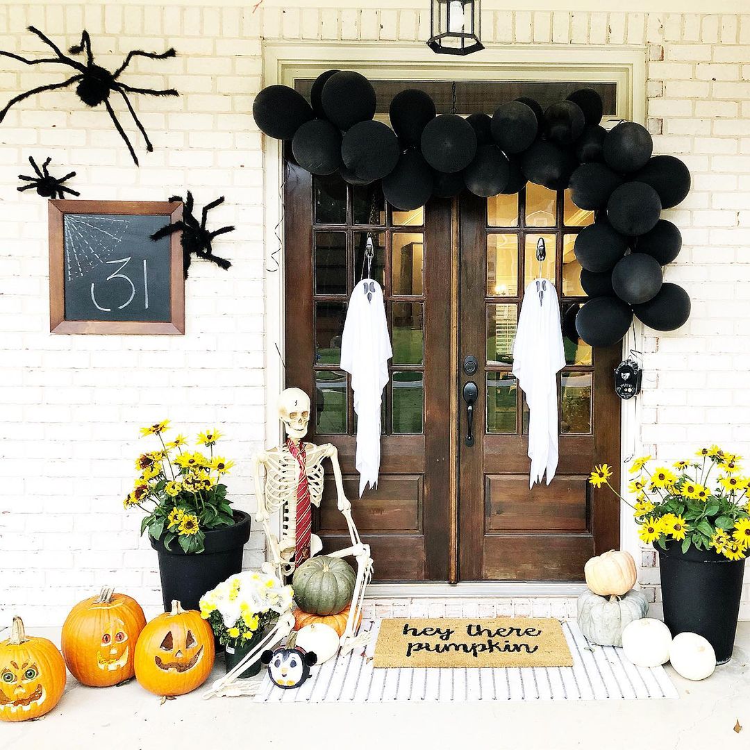 Playful Halloween Porch with Balloons and Skeleton