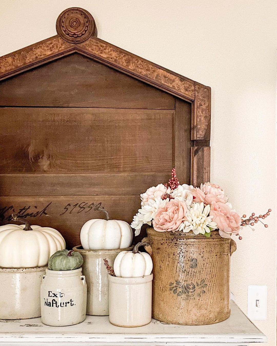 Style a Rustic Fall Display with Vintage Crocks and Neutral Pumpkins