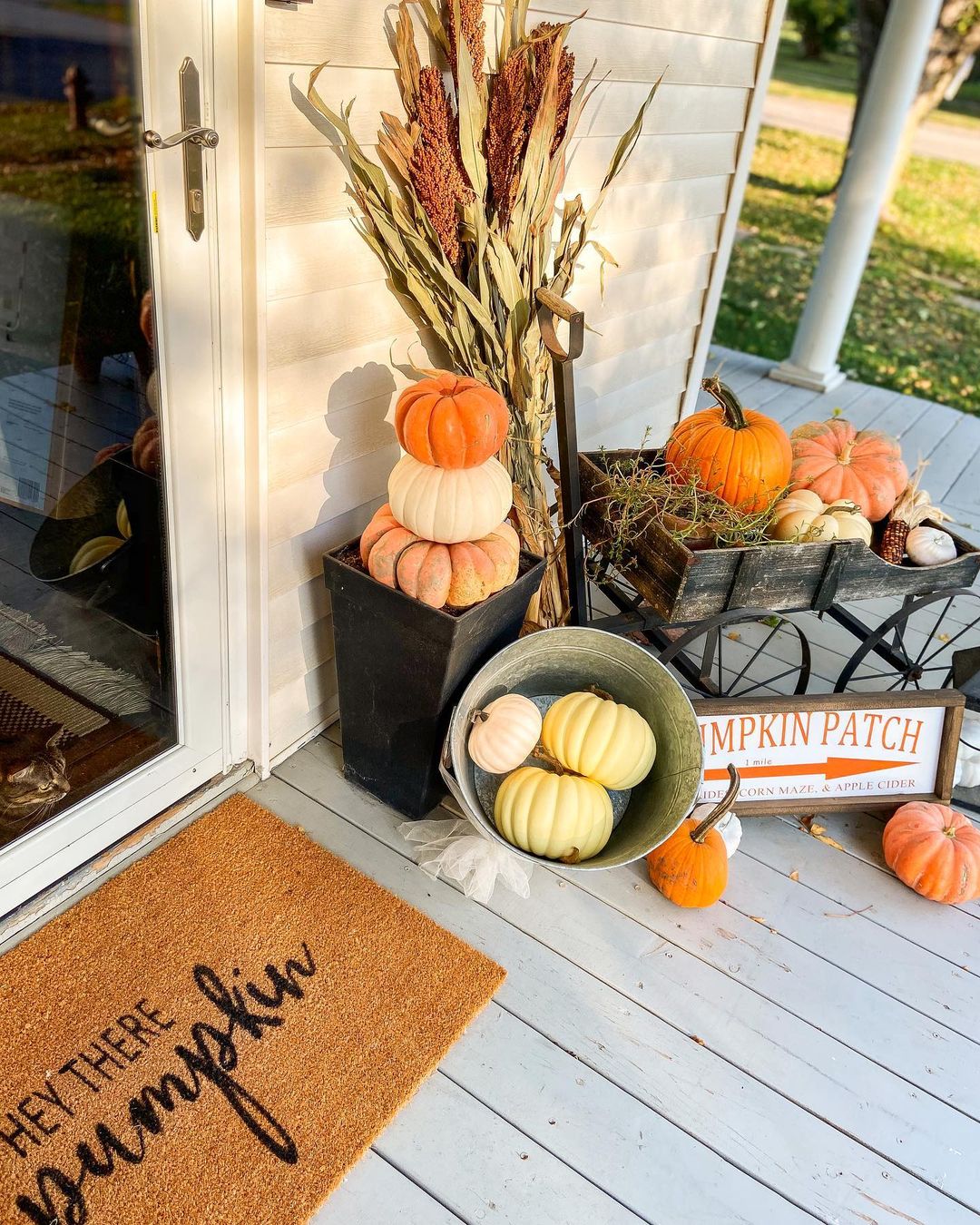 Rustic Fall Porch Display Featuring Pumpkins and Harvest Elements