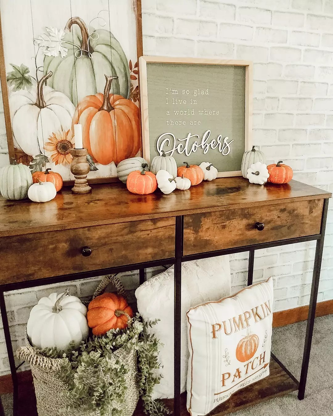 Decorate Your Console Table with Layered Pumpkin Displays for Rustic Fall Charm