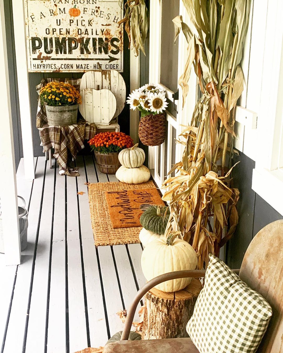 Rustic Fall Porch with Farmhouse-Inspired Decor and Natural Elements