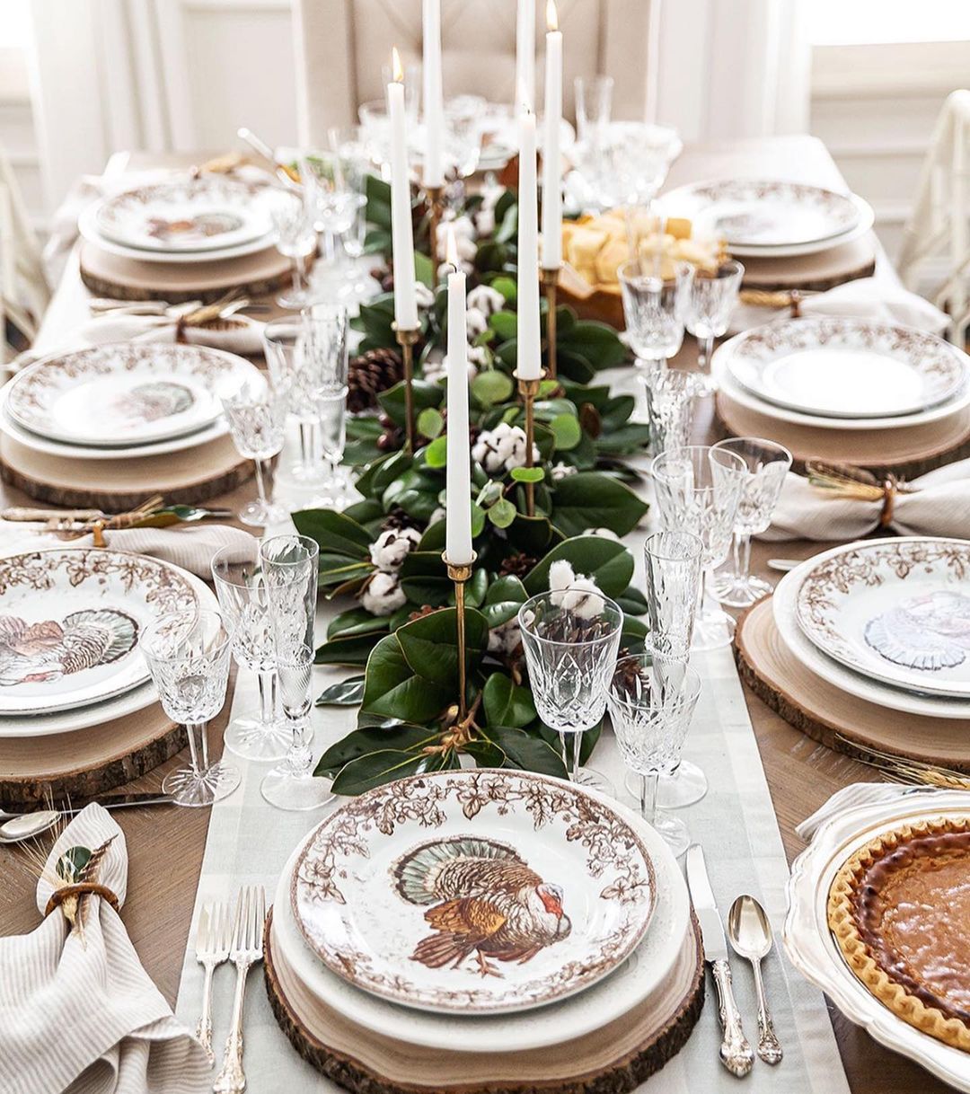 Classic Thanksgiving Table with Turkey Plates and Greenery