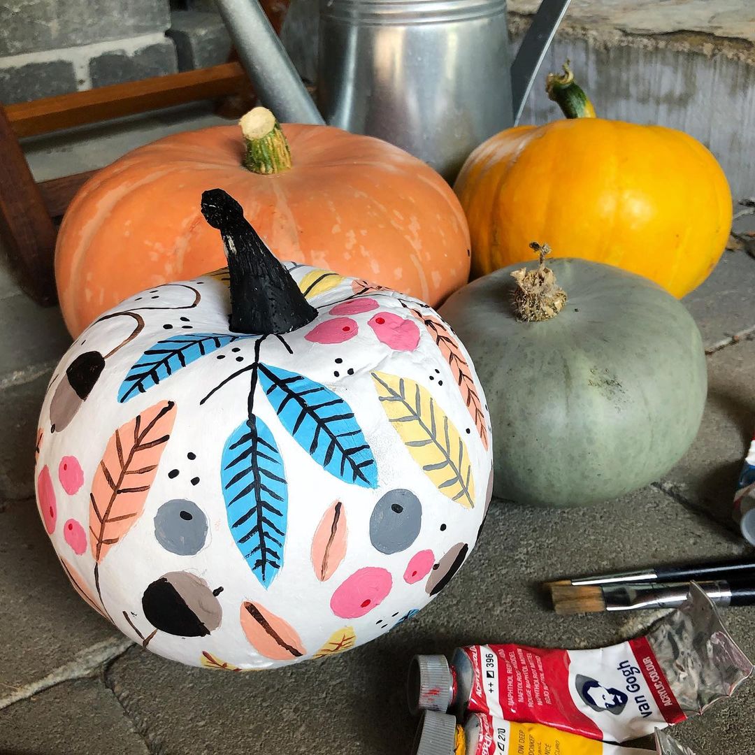 Colorful Abstract Leaf Patterns on a White Pumpkin