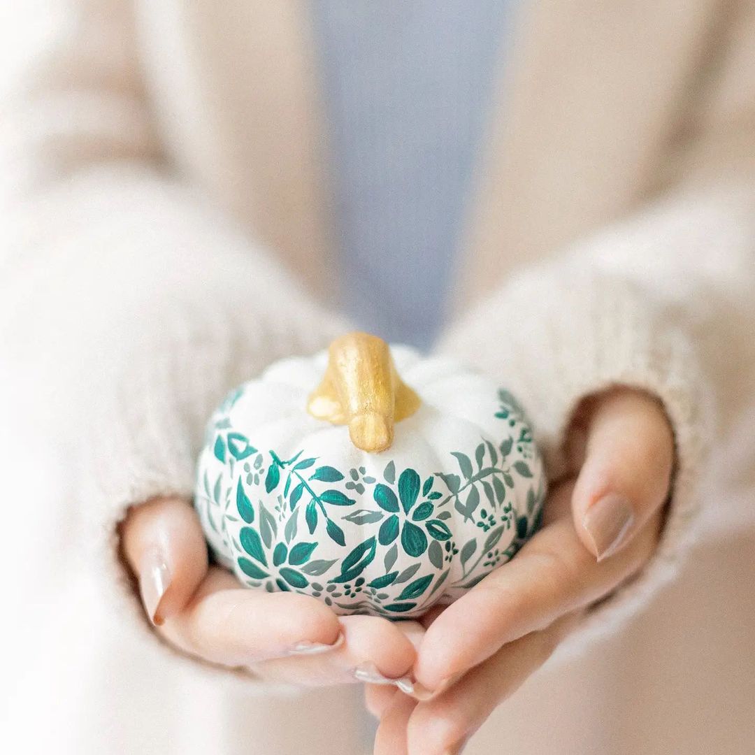 Delicate Greenery on a Miniature White Pumpkin