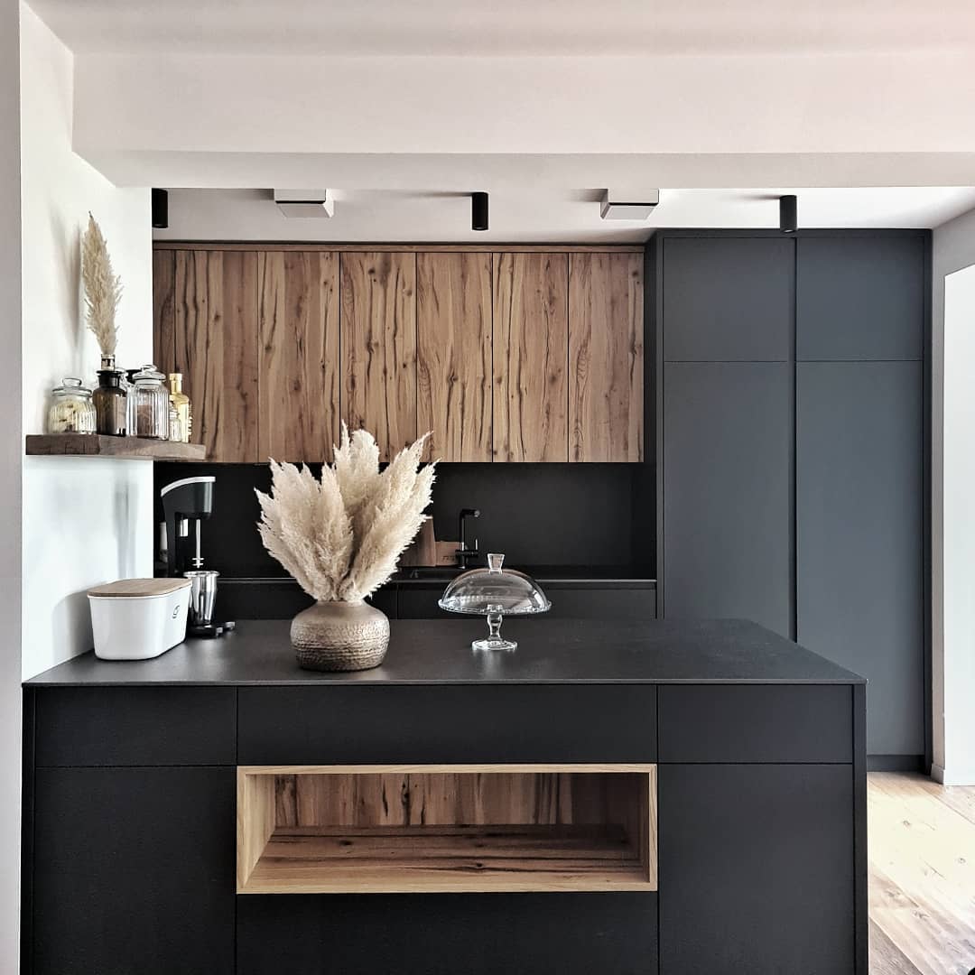 19. Sleek and Natural: Black Meets Wood