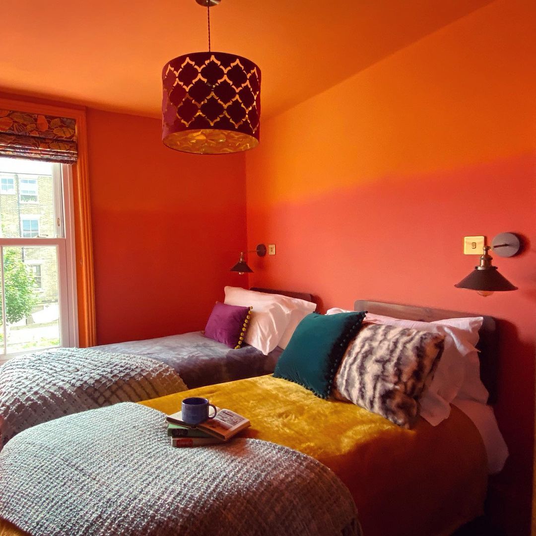 Gradient Walls With Bold Orange Color Accents