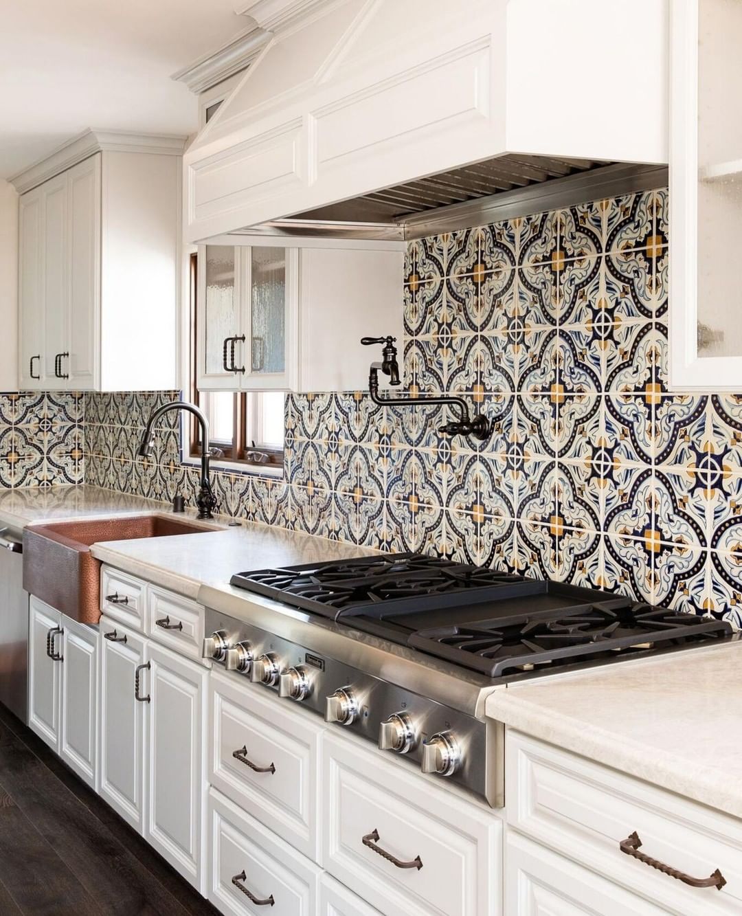 Intricate tiles in a vibrant Spanish kitchen.