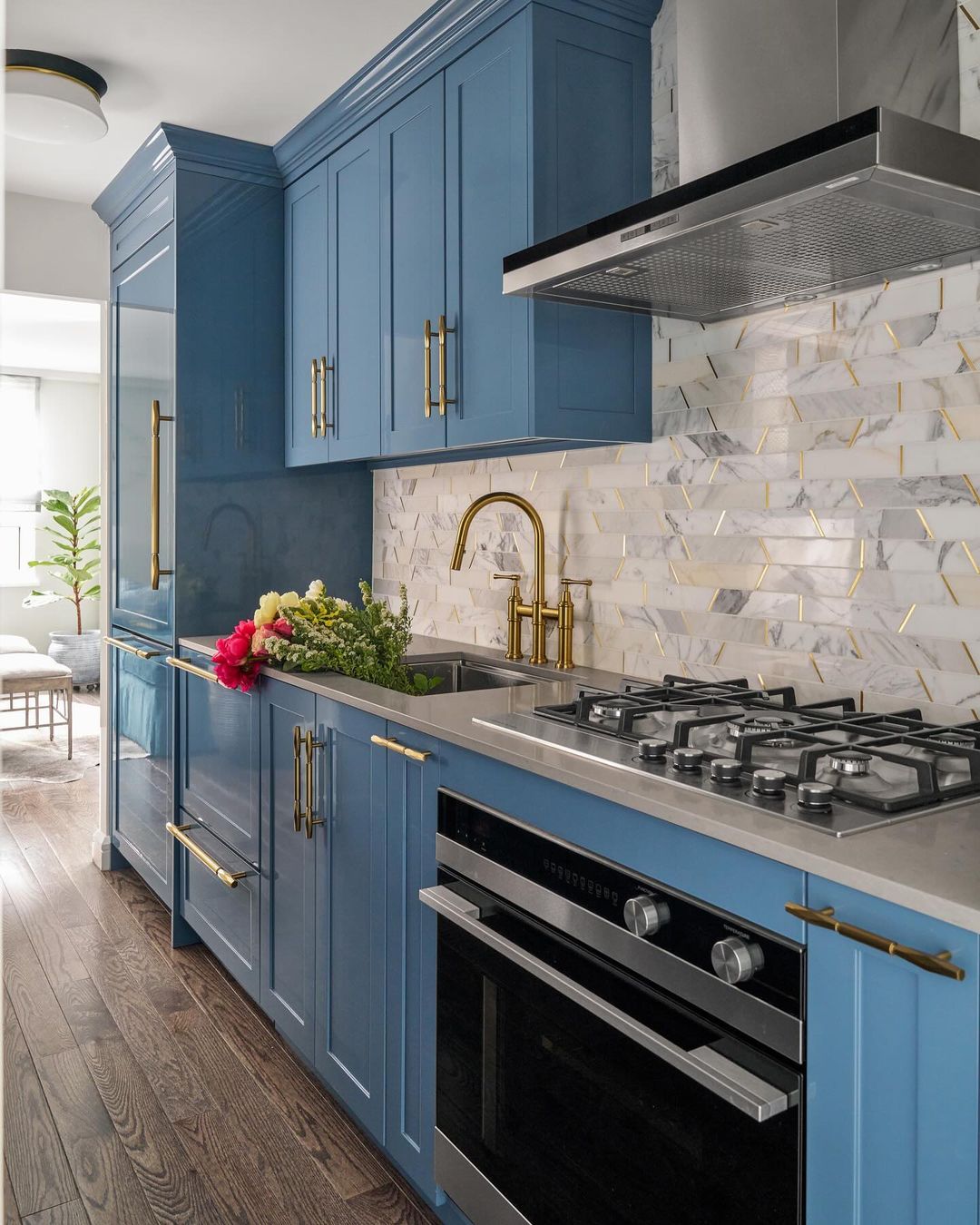 Bold Blue Cabinets With Geometric Marble