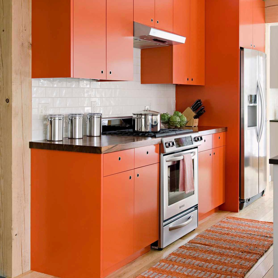 Bold Orange Cabinets With Warm Wood Touches