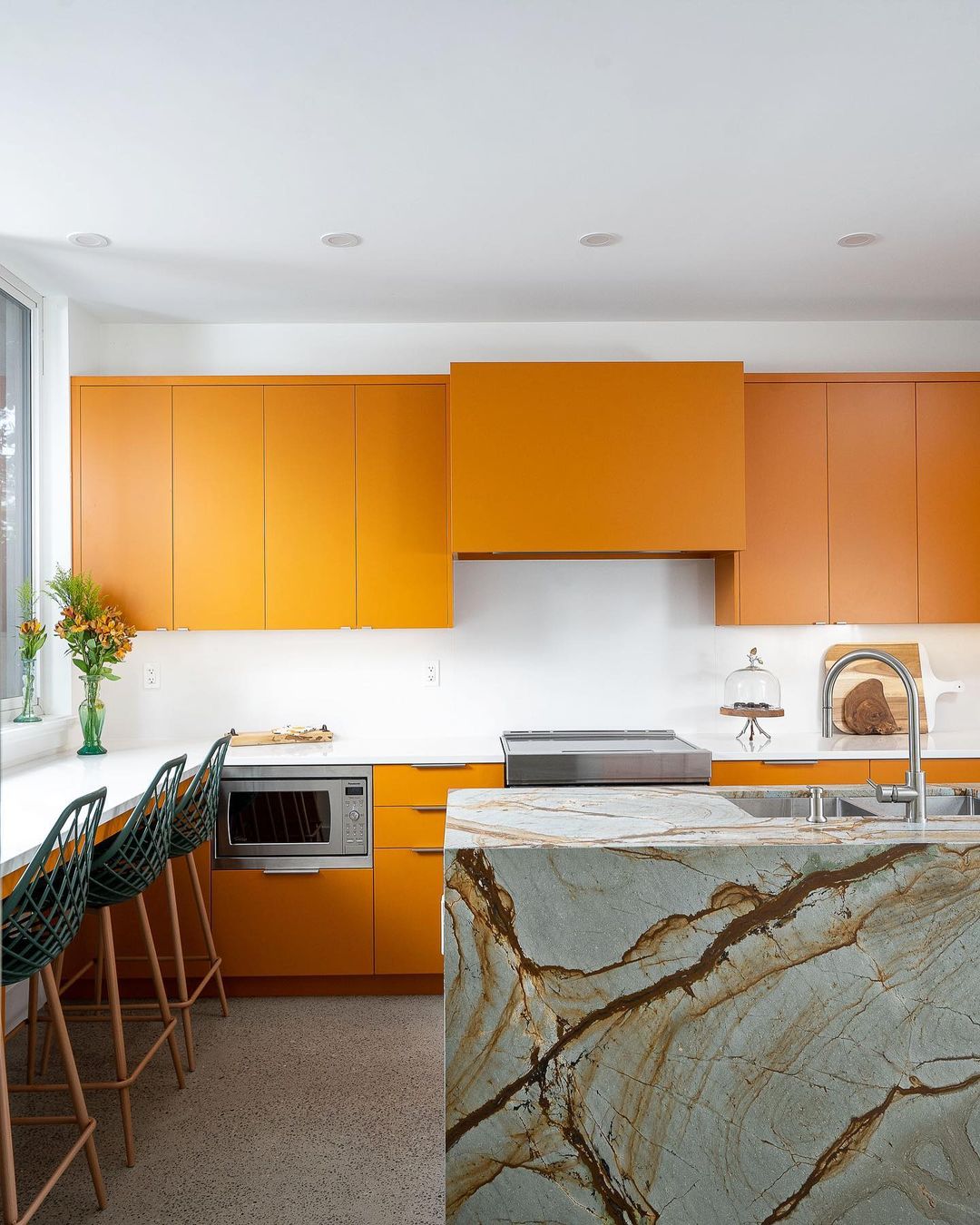 Bold Orange Cabinets Meet Luxurious Marble