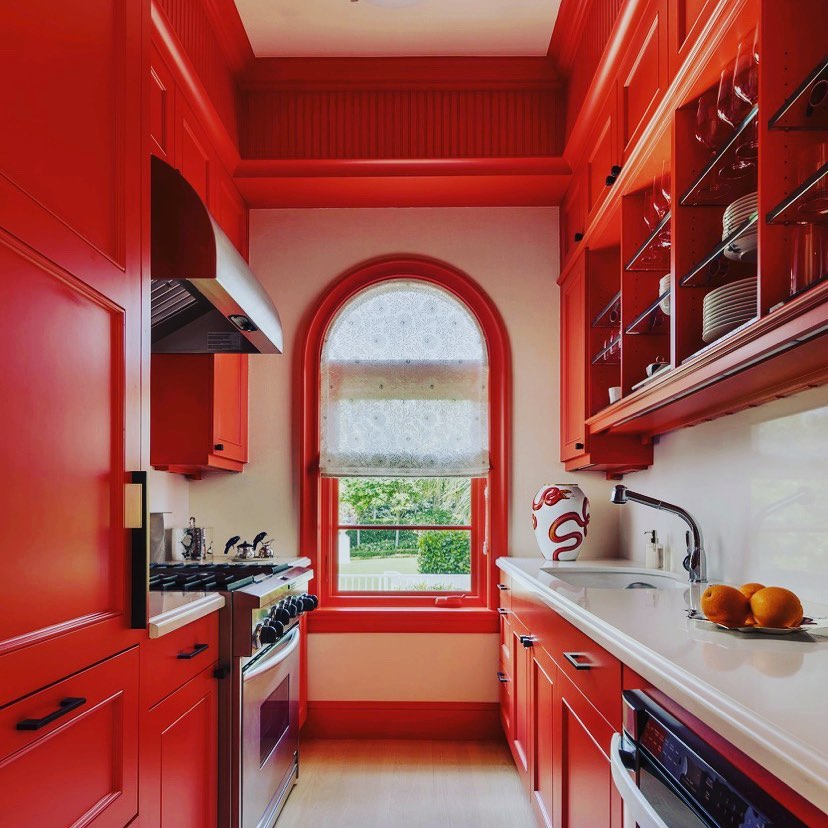 Orange Kitchen With Architectural Flair