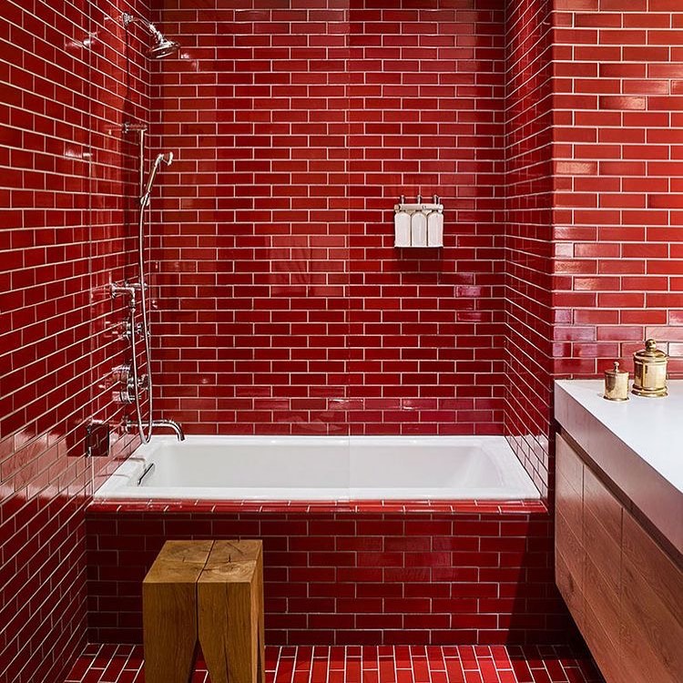 14. Sleek Red Tiles With Natural Warmth