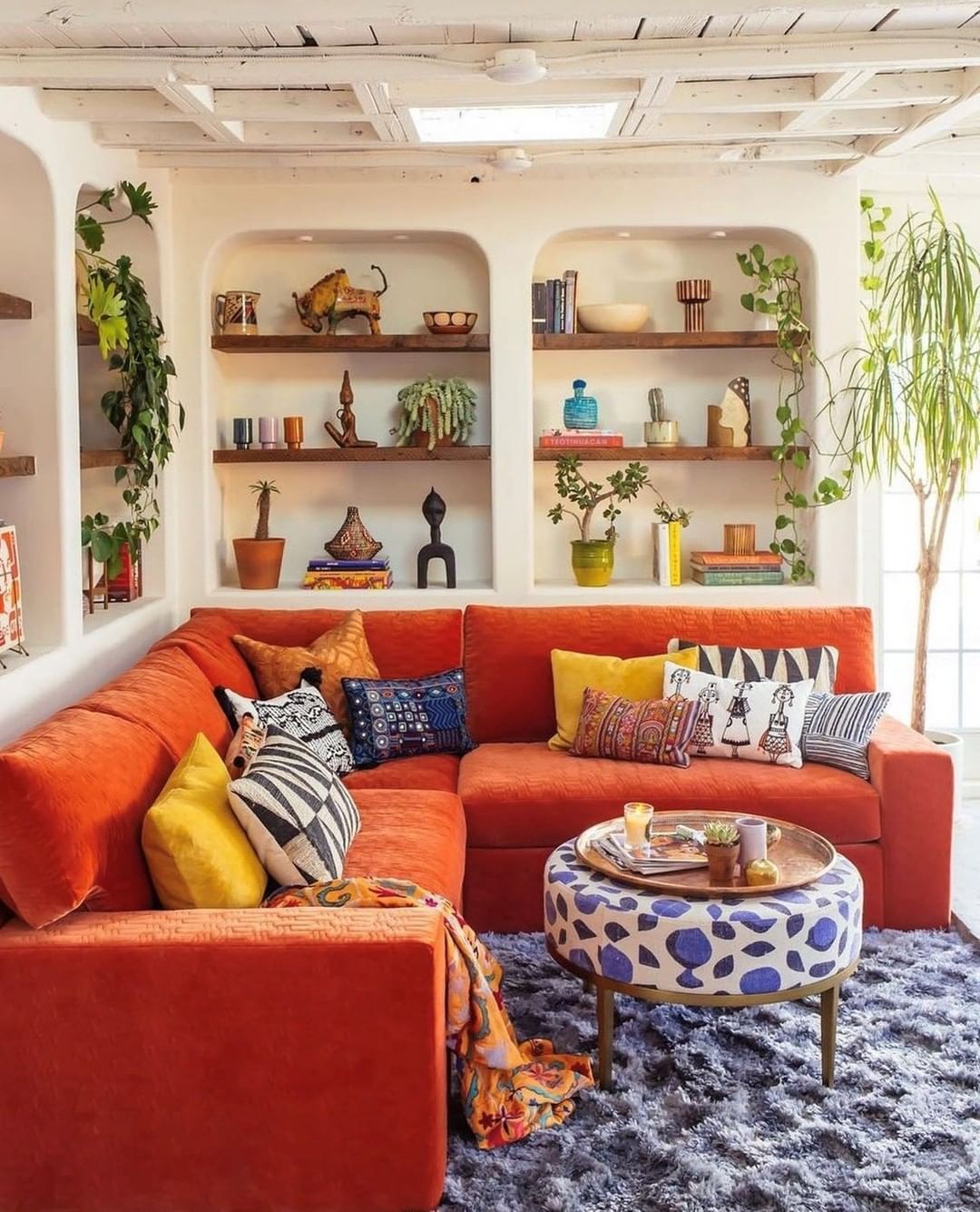 Bold Orange Couch With Global Flair