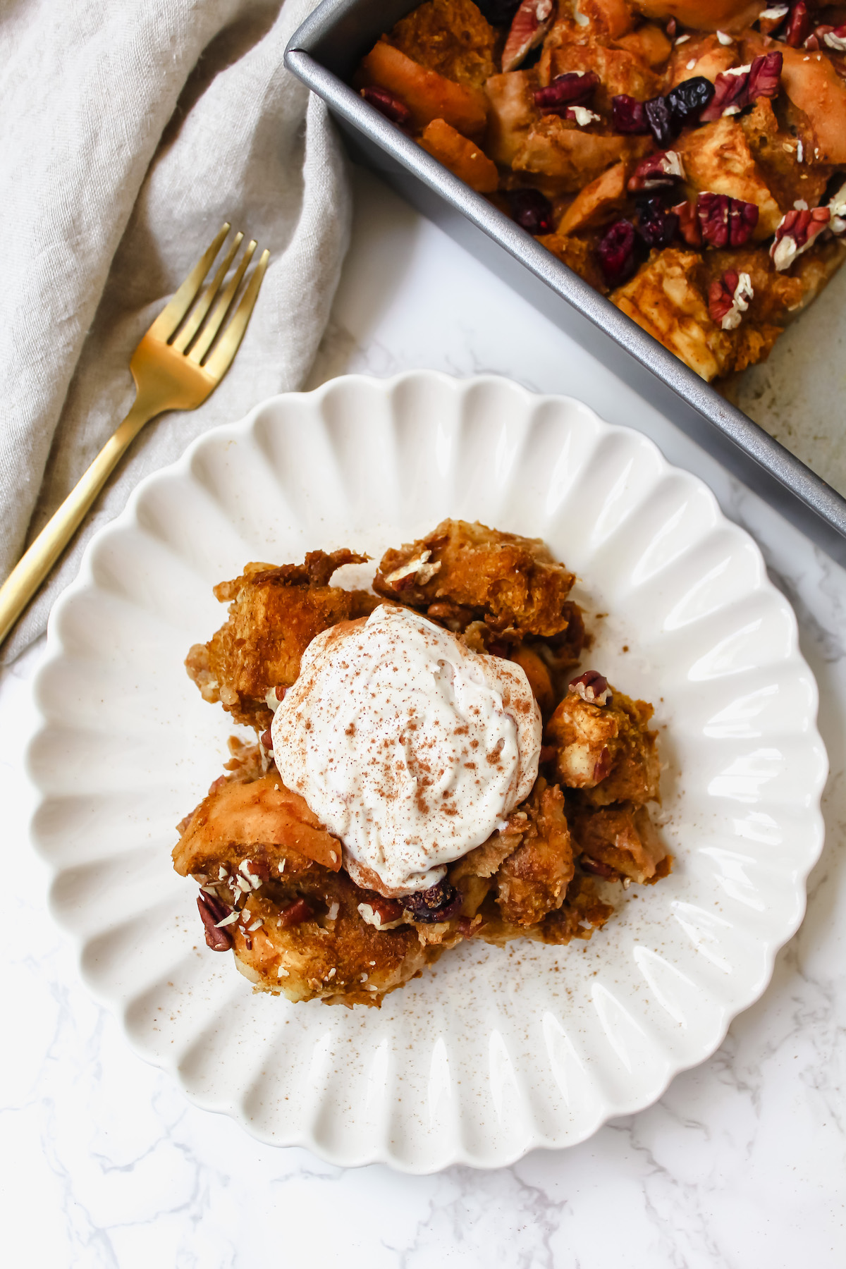 Sliced Casserole Topped with a Sprinkle of Cinnamon and Fresh Fruit