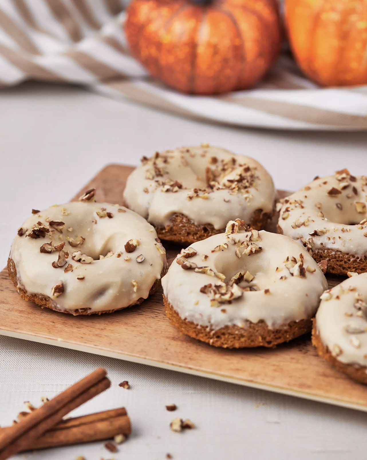 Pumpkin Spice Donuts with Maple Cream Cheese Glaze: Autumn Bliss in Every Bite